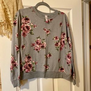 Woman’s floral sweater.